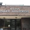Six Wilton Police officers pulled a man out of a car just moments before it was fully engulfed in flames on the night before Thanksgiving, police said.