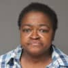 Bonita Brown, 57, of Westbury was arrested and charged with felony grand larceny.