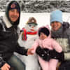 Six-month-old Brianna Mazzone enjoying her first snowfall with parents Mark and Jessica Mazzone. Also pictured is Frosty.