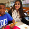 The Stamford Mentoring Program matches public school students with mentors to help provide academic and social support.