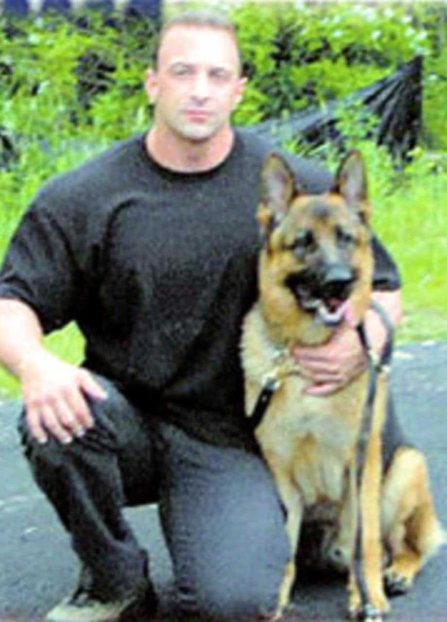 Nick Tartaglione with a K-9 officer in 2007 when Tartaglione was a member of the Briarcliff Manor Police Department.