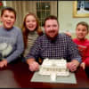 Ridgefield architect Keith Olsen with his three children, from left, Benjamin, Kaleigh and Miles.  Olsen built a miniature model of Grand Central Terminal from Legos.