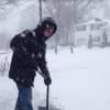 Danbury resident Barry Abrams shoveling snow in his driveway
