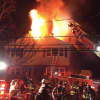 A photo of flames leaping out of 63 Riverdale Ave., Friday morning.