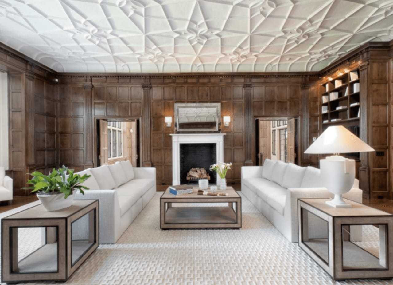 The home has 11 fireplaces, including this one in the living room.