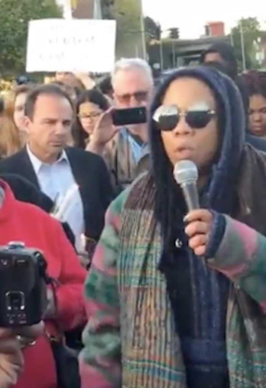 Mayor Joe Ganim is in the crowd at a vigil Wednesday evening in Bridgeport, behind a protester speaking to a Facebook Live audience.