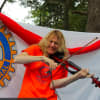Rotarian Daisy Jopling providing some live entertainment on her fiddle during a past Peekskill Horse Show & Country Fair.