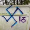 Lakewood Scoop posted this photo of anti-Semitic graffiti sprayed on a fence behind a business in Jackson.