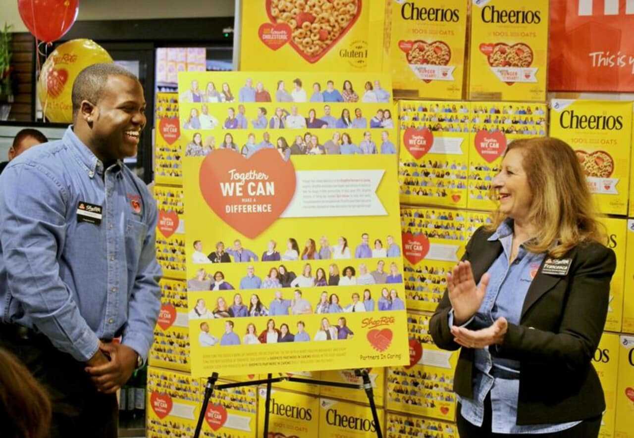 ShopRite employees Ramsey Rogers II of Ossining and Francesca Drago of West Harrison unveiled their special edition Cheerios box at the Thornwood store on Monday. The pair joined hundreds of other ShopRite employees in raising money to fight hunger.