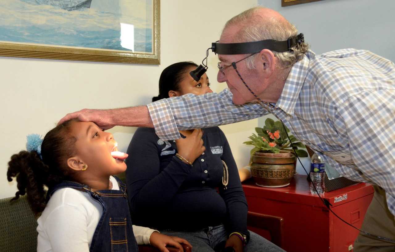 Dr. Lee Eisenberg sees patients during one of his overseas trips. 