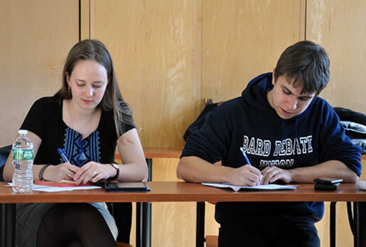 Two unidentified Bard College students act as judges during the recent debate tournament that attracted more than 100 high school students and teachers.