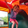 Bounce houses will be one of the Family Fund Day features -- as well as a rock wall, face painters and a dunk tank. [not a local photo]