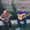 Jake and Jules played folk music on the lawn of Ossining Village Hall.