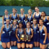 Members of the Wilton High School girls varsity tennis team show off the Class M championship award they received Friday.