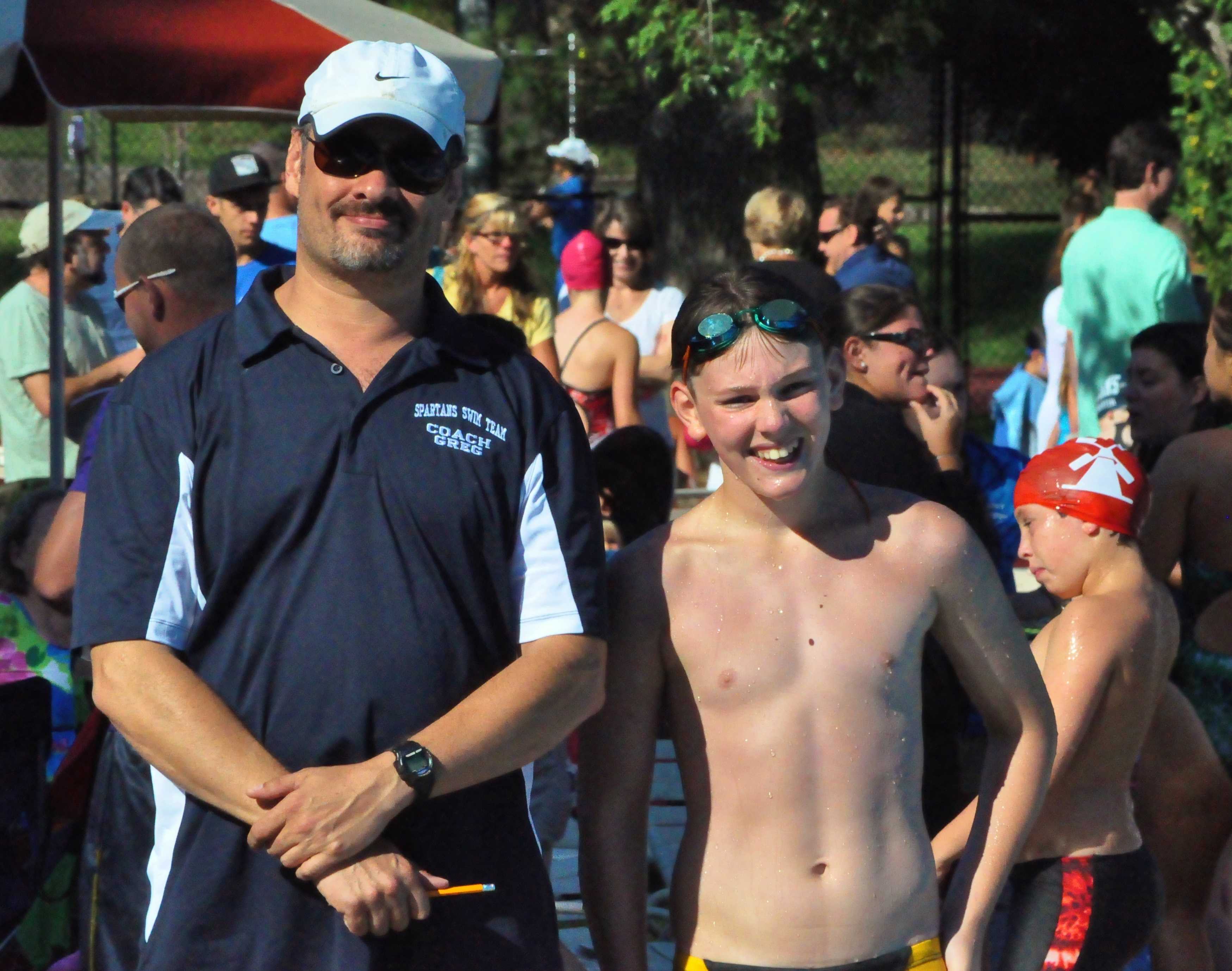 Ossining swimmer Alex Carrazzone and coach Greg Bernstein.