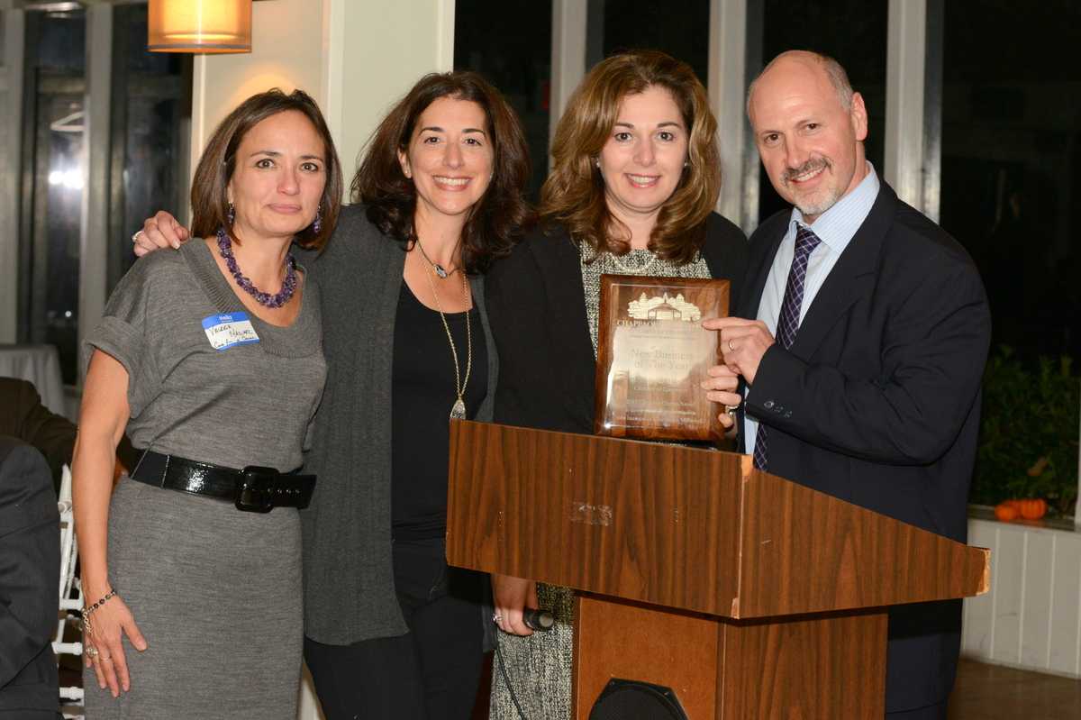 Rob Greenstein presents Consulting for a Cause with the New Business of the Year award.