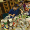 Students at the Westchester Day School in Mamaroneck sort food donated as part of their Martin Luther King Jr. Day of Service.