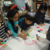 Westchester Day School students create a mural to be donated to the Spring Brook Manor Nursing Home in Scarsdale.