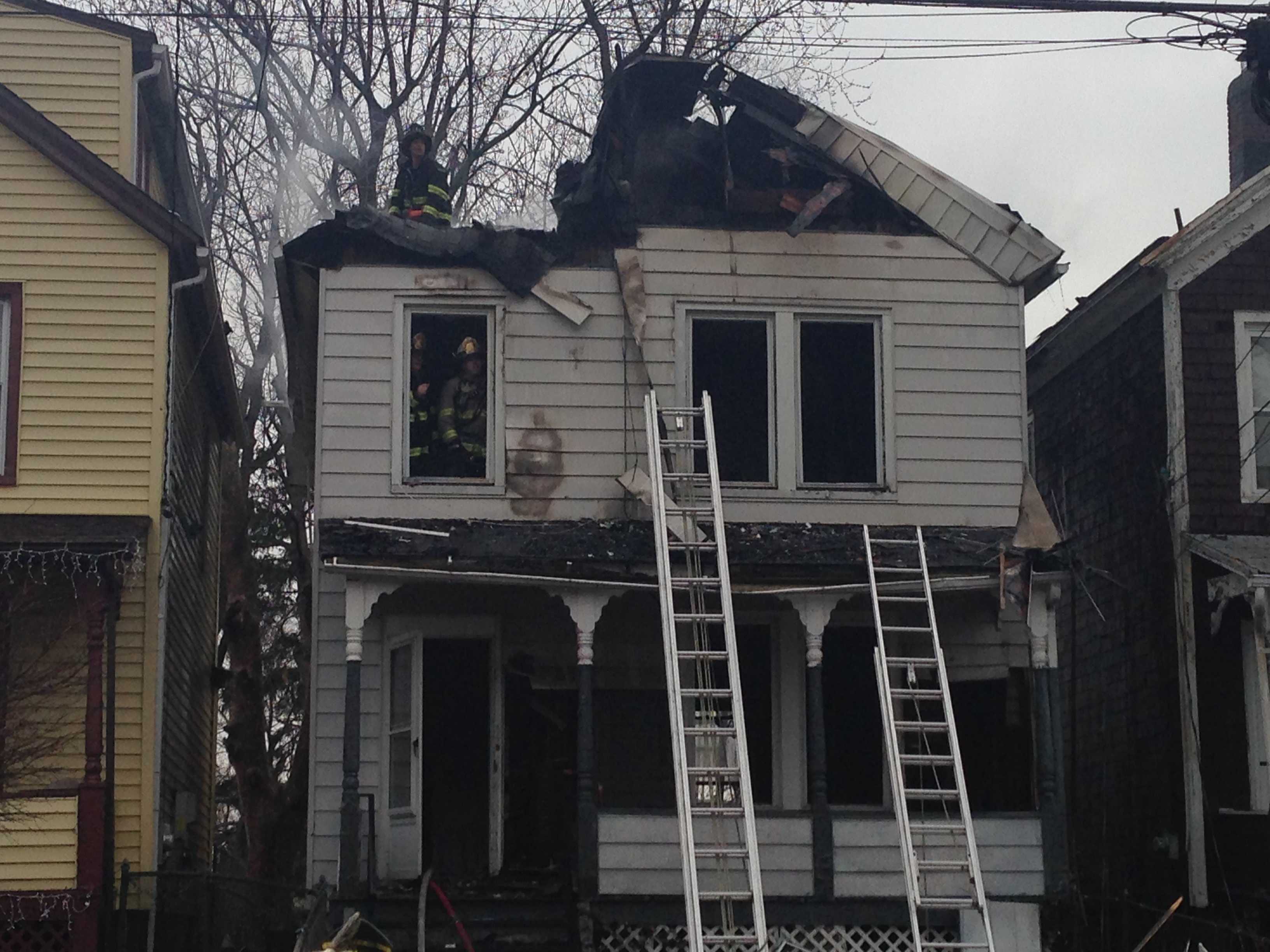 Shortly after firefighters arrive at the scene of a three-alarm house fire on 94 State Street in Ossining on Friday, there was a partial roof collapse.