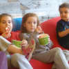 Young yogurt lovers enjoy their treats on giant bean bags at Hartsdale's Peachwave.