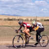 Amy Dixon pedals with Lindsey Cook at a recent workout.