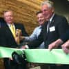 Wilton First Selectman Bill Brennan, left, Peter Woods, President and CEO, Dorel Recreational/Leisure, center, and Norwalk Mayor Harry Rilling cut the ribbon at the grand opening of Cannondale Sports Unlimited's new headquarters in Wilton.