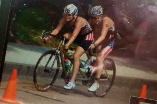 Amy Dixon, right, and Caroline Gaynor ride on the bike during the race. 