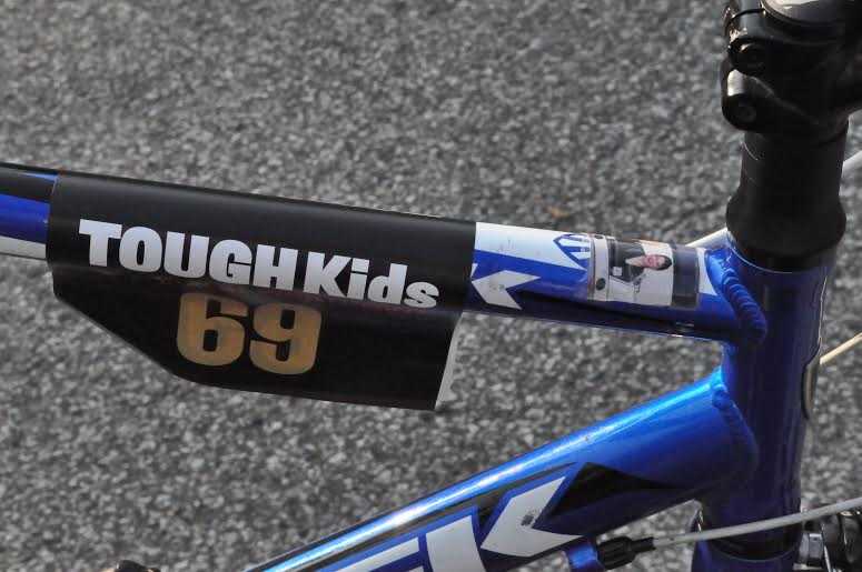The picture of his bike shows the picture of Caroline Corley he taped onto it for good luck.