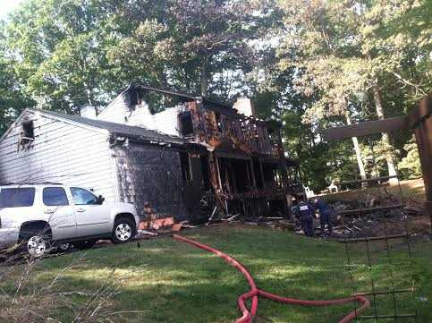A large home at 25 Bittersweet Lane in North Stamford is in ruins after an overnight fire. 