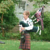 Bagpiper Stephanie Moore of the New Canaan Volunteer Ambulance Corps plays "Amazing Grace."