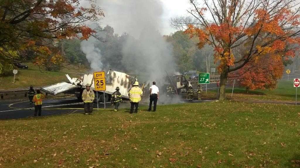 The Greenwich Fire Department is putting out the truck fire on the Merritt Parkway.