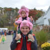 Harry Grand with his son, Win, following Bedford Village's Halloween Parade.