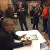Tommy Wiesenberg of Larchmont meets renowned sports writer Mike Lupica Sunday following a community program called Harvey Presents: Mike Lupica in The Walker Center for the Arts in Katonah.