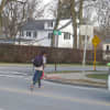 <p>The adult and children cross where there is no crosswalk. A northbound car on Boston Post Road stopped to allow them to finish crossing safely.</p>