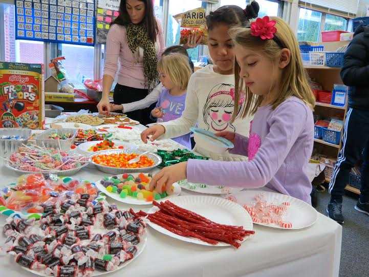 <p>First-graders at Carrie E. Tompkins Elementary School in Croton-Harmon celebrated the beginning of the holiday season by creating candy houses with their parents.</p>