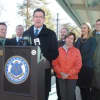 Flanked by state representatives at Stamford's Springdale station, Gov. Dannel P. Malloy announces new M-8 cars have begun operating on the New Canaan Branch.
