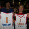 <p>Bettye H. Perkins, left, founder and chief executive officer of Today&#x27;s Students, Tomorrow&#x27;s Teachers and Deborah Fay of Entergy display jerseys given away at Friday&#x27;s basketball game.</p>