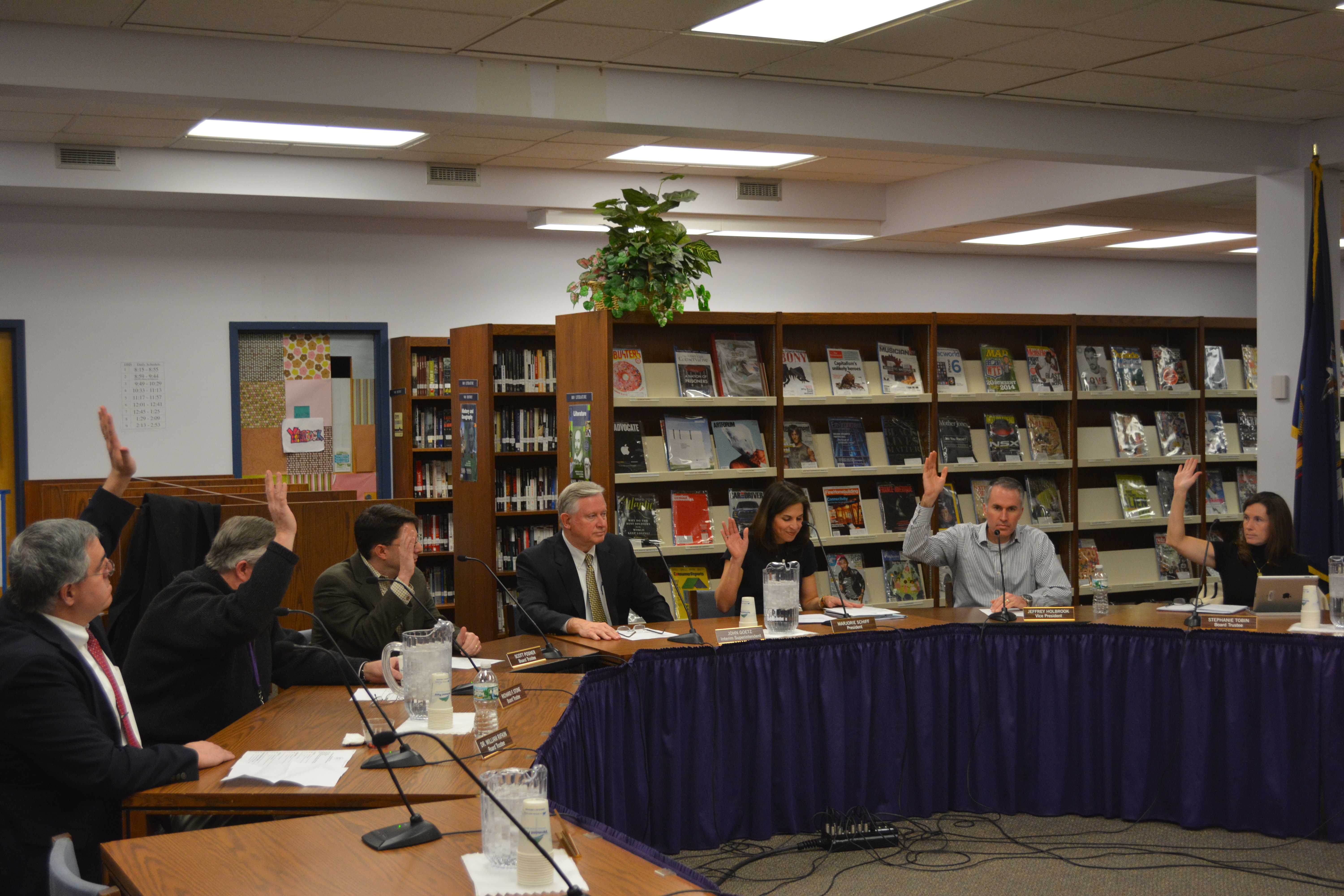 Katonah-Lewisboro school board members raise their hands to unanimously approve Andrew Selesnick as the school district's next superintendent.