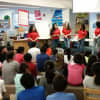 Students from HEART, who attend Brien McMahon High School in Norwalk, talk to students at Brookside Elementary in Norwalk.