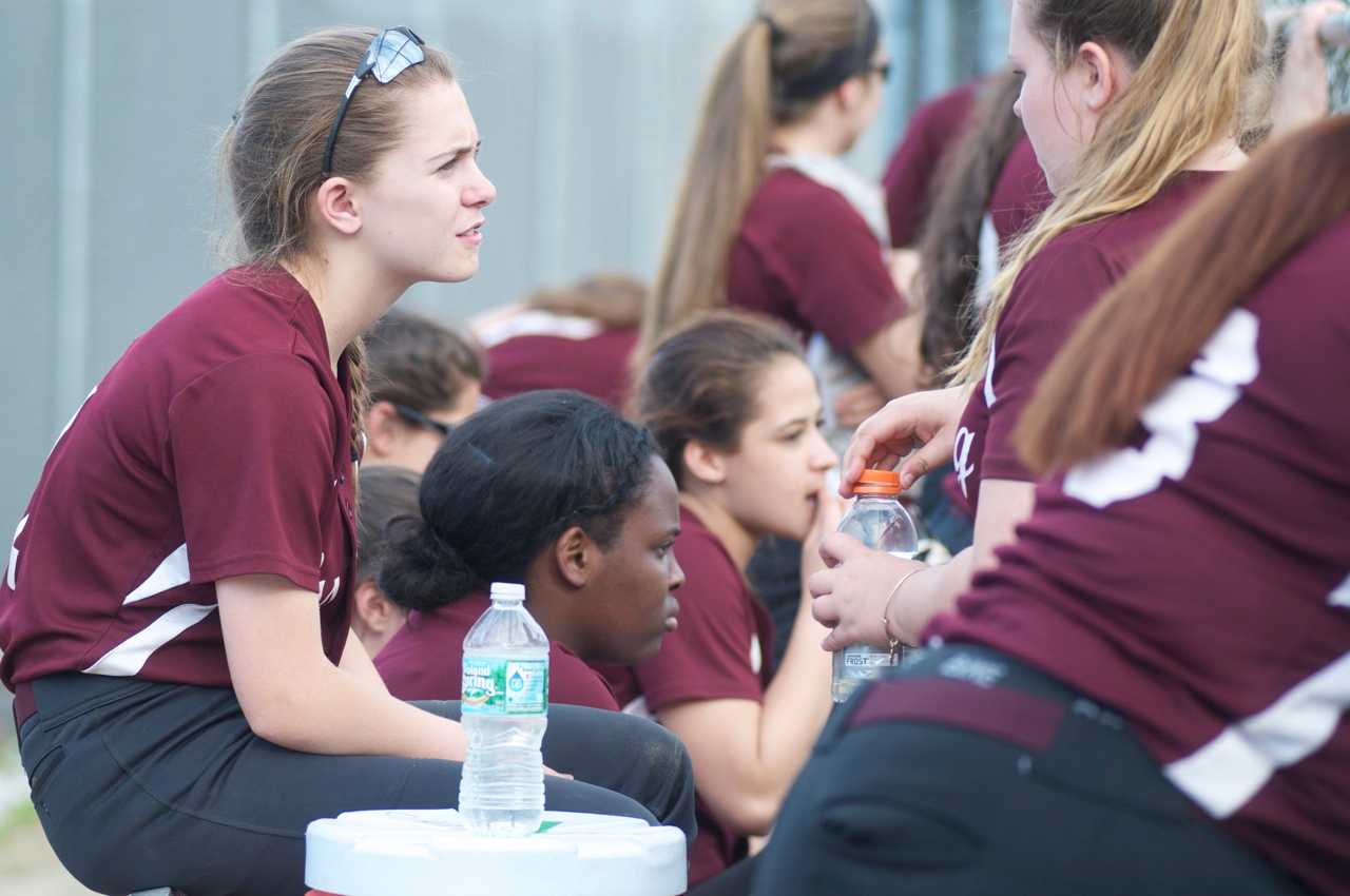 Ossining players between innings. 