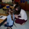 A teacher speaks to a world language student in the New Rochelle School District.