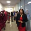 Briggs Principal Marie Allen checks out her graduating students. 