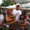 From left: Claudia Weber, Lia Toth with 'Peewee,' Claude Colabella, and Charlotte Frank holding 'Pookie" outside the Strays & Others tent at the New Canaan sidewalk sale Saturday.
