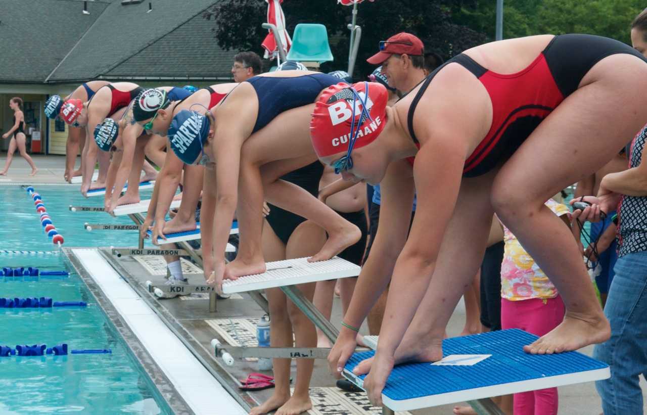 Swimmers set to start a race.