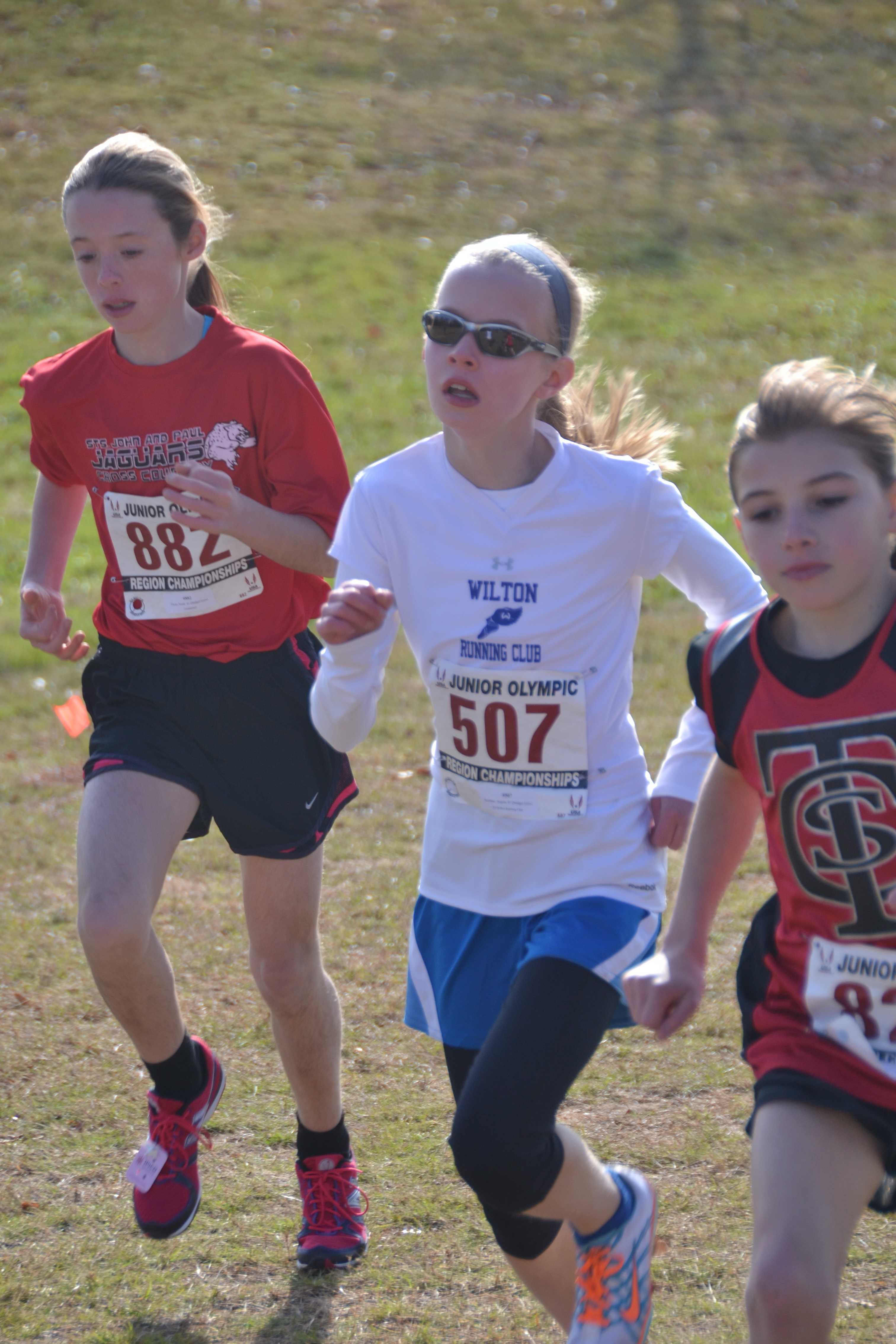 Angela Saidman of the Wilton Running Club runs to a second-place finish in the Midget Girls division.