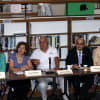 A panel made up of local business leaders and school officials listens to the children's presentations at the Ossining High School last month.