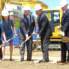 Mayor Michael Pavia (middle), Stamford Hospital CEO and President Brian Grissler, (second from right), and other notables dug in to break ground on the new hospital. 