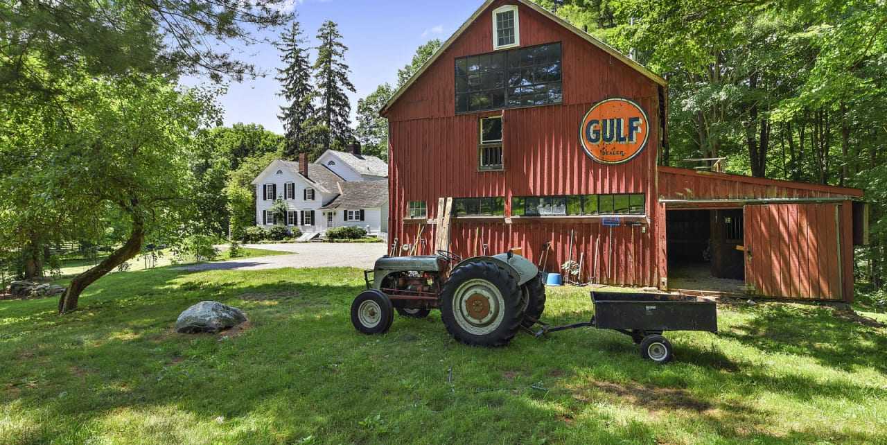 The home includes a two-story barn with an attached guest suite.