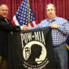 Eastchester Town Supervisor Anthony S. Colavita and Lawrence LaFredo, who donated the flag from Greenburgh.