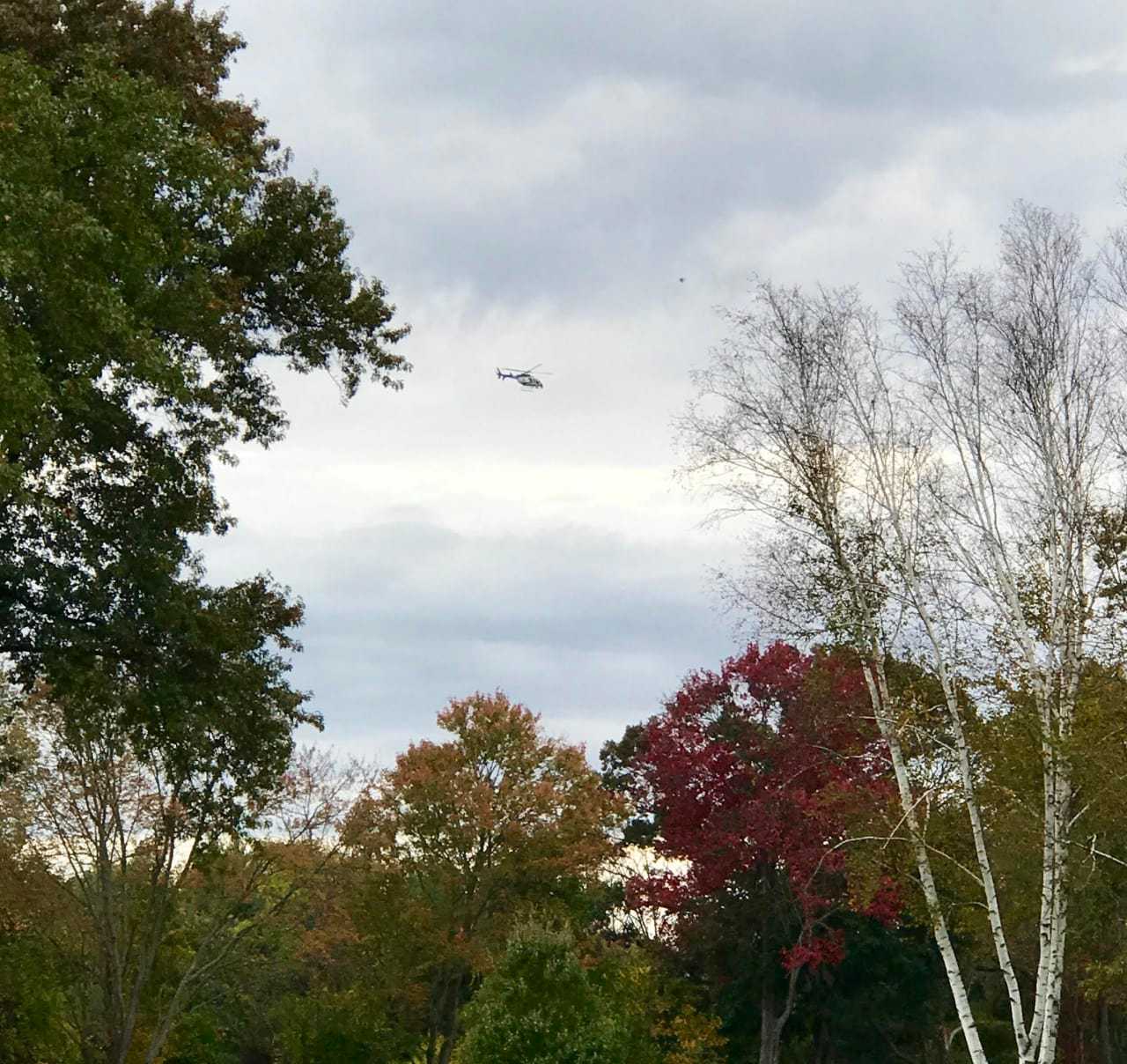 A Westchester County helicopter circles the area near the  Waccabuc Country Club where a search began in the middle of the afternoon Wednesday.